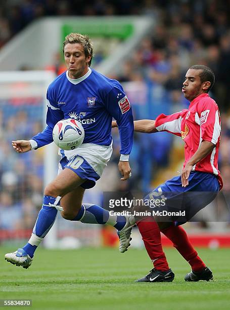 Darren Currie of Ipswich is tackled by Paul Bignot of Crewe during the Coca-Cola Championship match between Ipswich Town and Crewe Alexandra at...