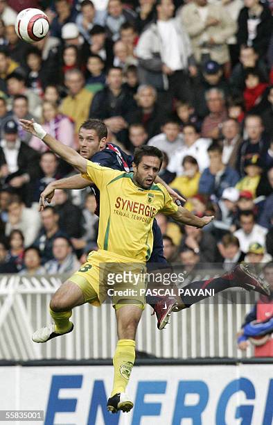 Paris defender Sylvain Armand vies with Nantes defender Franck Signorino during their French L1 football match, 01 October 2005 at the Parc des...