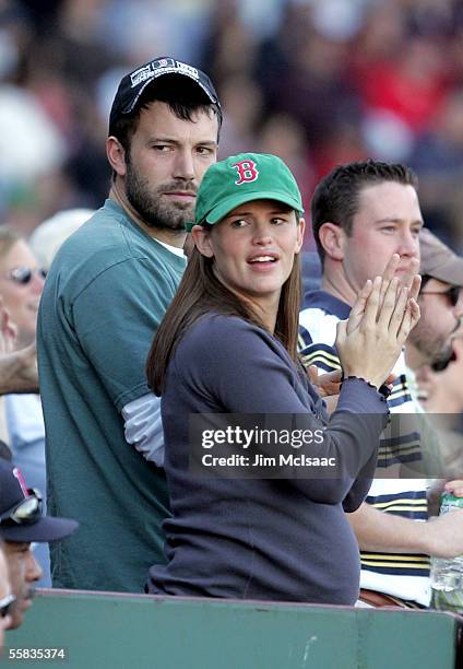 Actor Ben Affleck and wife, actress Jennifer Garner watch the Boston Red Sox play the New York Yankees at Fenway Park on October 1, 2005 in Boston,...