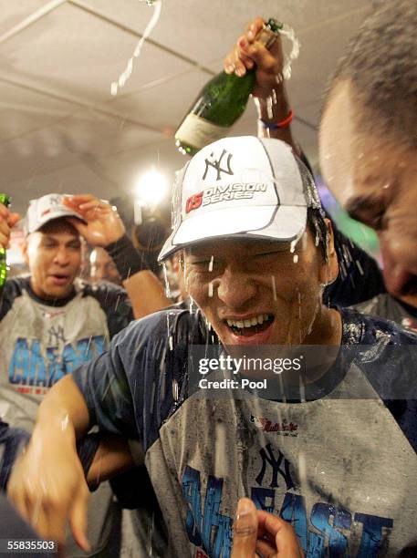 Hideki Matsui celebrates in the locker room after the New York Yankees clinched the AL East division title by defeating the Boston Red Sox at Fenway...