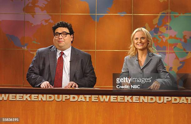In this handout photo provided by NBC studios, Amy Poehler and Horatio Sanz perform during "Weekend Update" on "Saturday Night Live's" season...