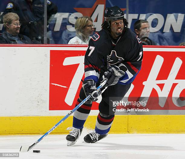 Right wing Anson Carter of the Vancouver Canucks carries the puck during a preseason game against the Edmonton Oilers at General Motors Place on...