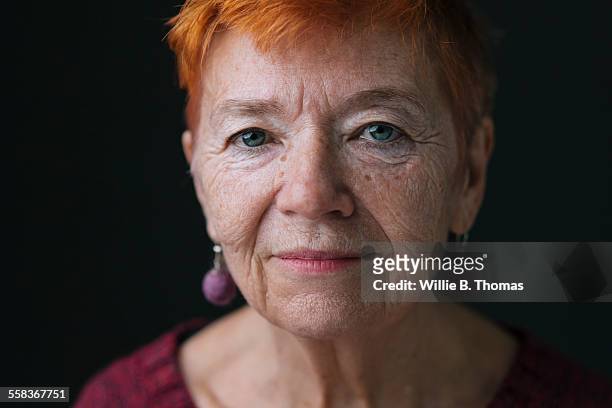 close-up portrait of confident senior woman - eye color stock pictures, royalty-free photos & images