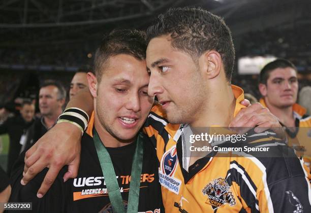 Scott Prince and Benji Marshall of the Tigers share a moment after winning the NRL Grand Final between the Wests Tigers and the North Queensland...