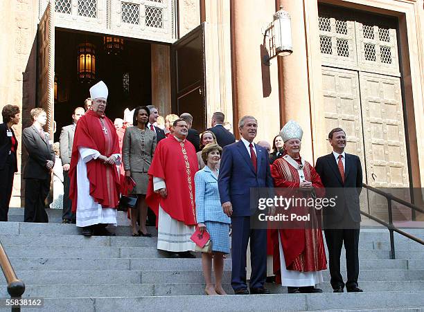 First lady Laura Bush, US President George W. Bush, Cardinal Theodore McCarrick, Archbishop of Washington, and new Chief Justice John Roberts stand...