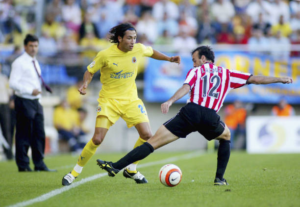 Jose Mari of Villarreal is challenged by Jesus Maria Lacruz of Athletic during the La Liga match between Villarreal v Athletic Bilbao played at the...