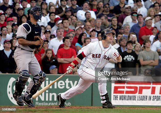 Trot Nixon of the Boston Red Sox hits a sacrifice fly ball during the third inning of the game against the New York Yankees giving the Red Sox a 1-0...