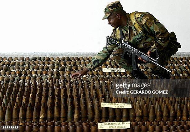 Soldier prepares ammunitions seized to the 47th squad of the Revolutionary Armed Forces of Colombia , before being displayed to the press 02 October...