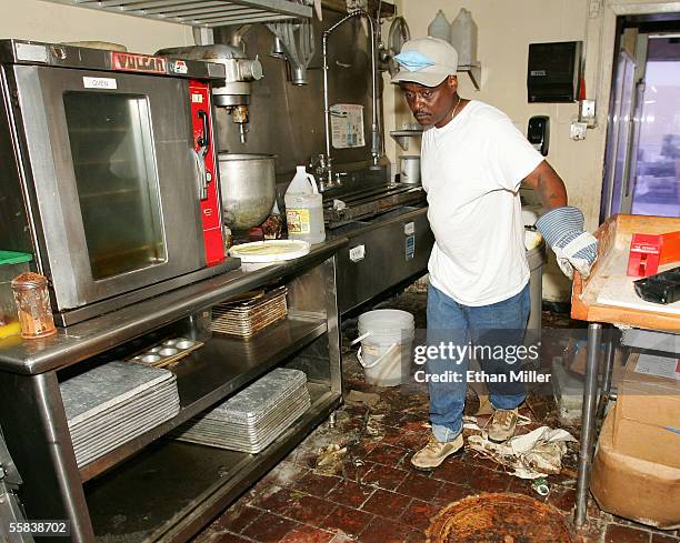 Baker Willie Watson pulls a garbage can through the Tastee Donuts shop October 2, 2005 in New Orleans, Louisiana. Residents of New Orleans are still...