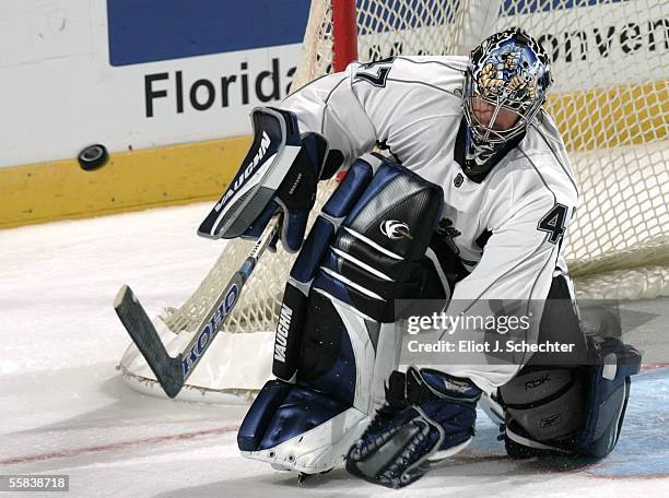 Goalie John Grahame of the Tampa Bay Lightning makes a save against the Florida Panthers on October 2, 2005 at the Bank Atlantic Center in Sunrise,...