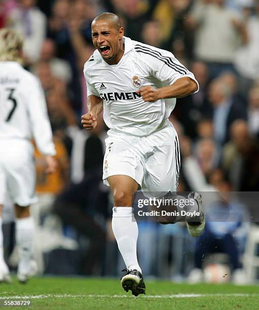 Roberto Carlos of Real Madrid celebrates after scoring a goal during a La Liga match between Real Madrid and Mallorca at the Bernabeu on October 2 in...