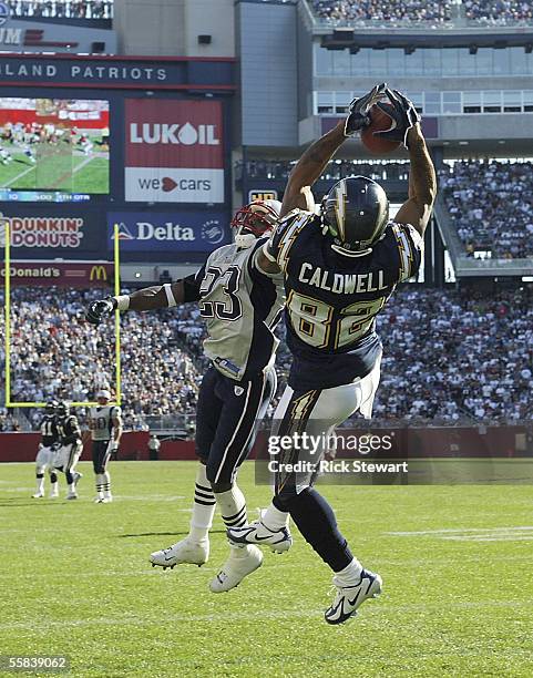 Wide receiver Reche Caldwell of the San Diego Chargers catches a 28-yard touchdown pass against cornerback Duane Starks of the New England Patriots...