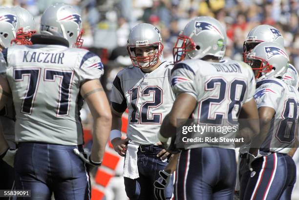 Quarterback Tom Brady of the New England Patriots waits to call a play in the huddle against the San Diego Chargers on October 2, 2005 at Gillette...