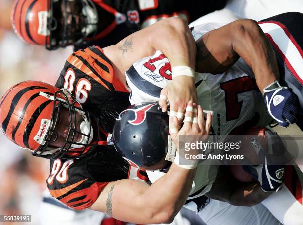 Defensive end Justin Smith of the Cincinnati Bengals tackles running back Domanick Davis of the Houston Texans at Paul Brown Stadium on October 2,...
