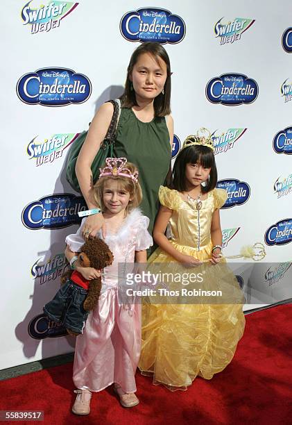 Soon-Yi Previn, wife of actor Woody Allen, and their daughters Manzie and Bechet Allen attend the "Cinderella" red carpet premiere in honor of the...