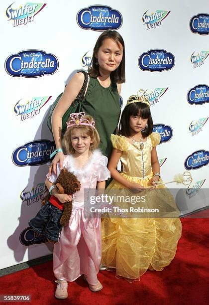 Soon-Yi Previn, wife of actor Woody Allen, and their daughters Manzie and Bechet Allen attend the "Cinderella" red carpet premiere in honor of the...