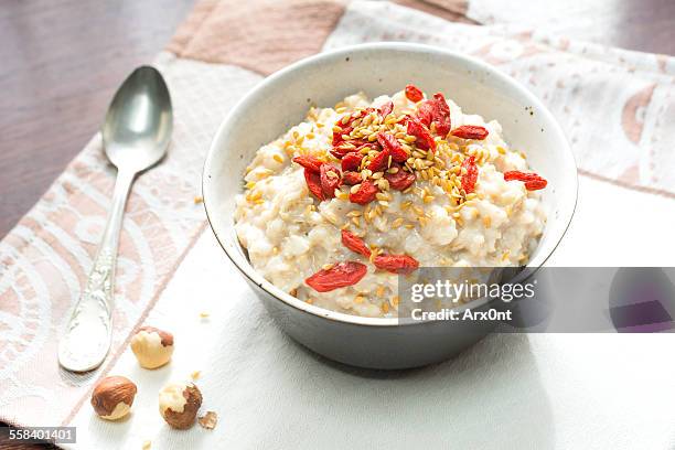 oatmeal porridge with goji berries - flax seed stock pictures, royalty-free photos & images