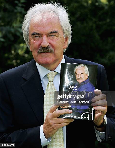 Presenter Des Lynam poses with his book before attending the book launch for today´s publication of Des Lynam´s autobiography "I Should Have Been At...