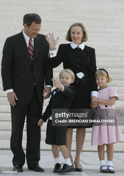 Washington, UNITED STATES: Chief Justice John G. Roberts, Jr. Stands with his wife Jane while outside the Supreme Court with his son Jack and...