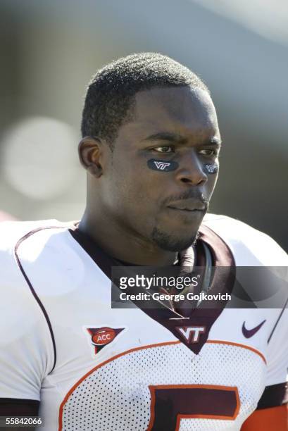 Quarterback Marcus Vick of the Virginia Tech Hokies watches the action from the sideline during a game against the West Virginia University...