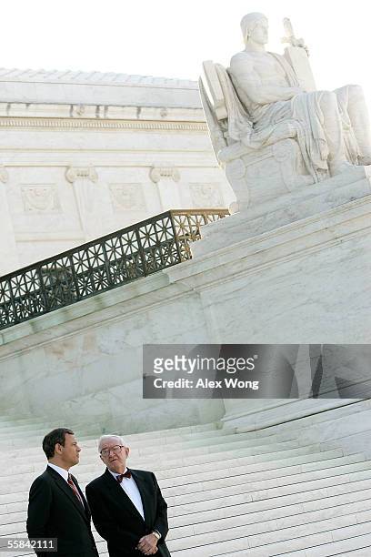 Supreme Court Chief Justice John G. Roberts talks to Justice John Paul Stevens after an investiture ceremony at the Supreme Court October 3, 2005 in...