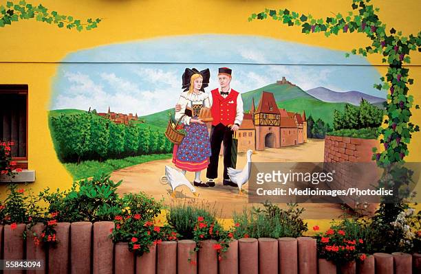 colorful sign showing couple in rural scene on a wine route, alsace, france - alsazia foto e immagini stock