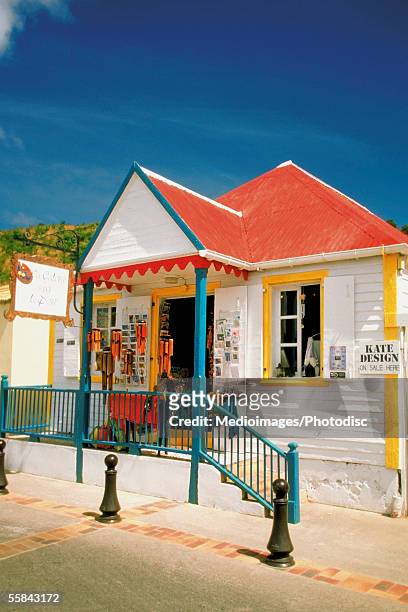 facade of a shop with red roof, st. gustavia, st. barts - gustavia harbour stock pictures, royalty-free photos & images