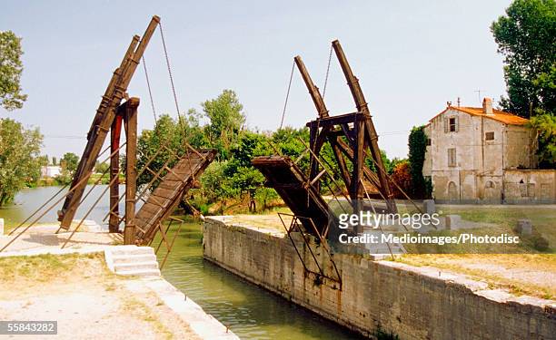 drawbridge over a canal, arles, provence, france - rhone river stock pictures, royalty-free photos & images