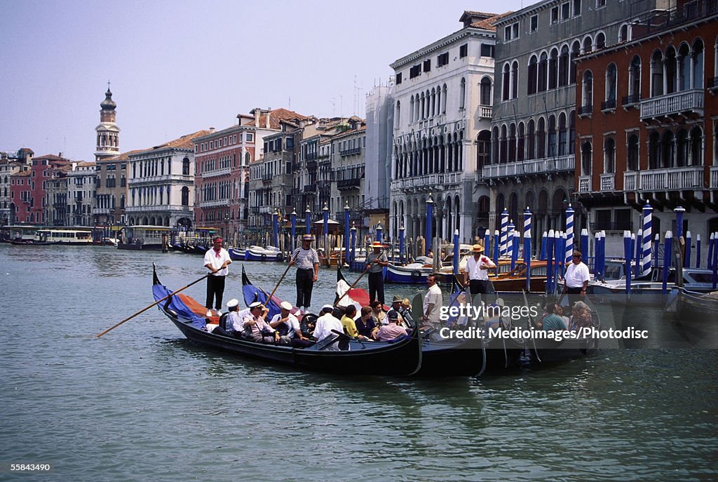 Tourists in gondolas, Venice, Italy