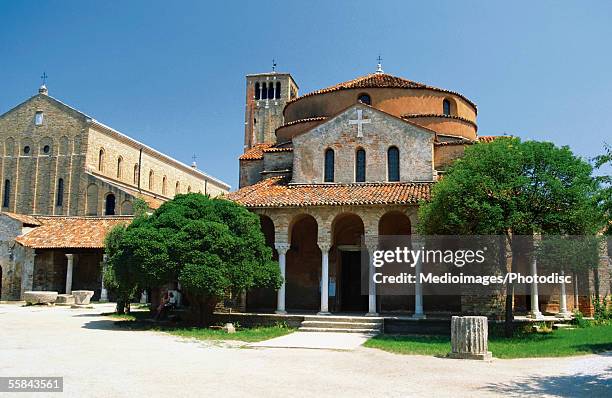 facade of a cathedral, torcello, venice, italy - torcello stock pictures, royalty-free photos & images