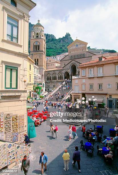 high angle view of tourists walking on a road near a cathedral, amalfi, italy - amalfi stock pictures, royalty-free photos & images