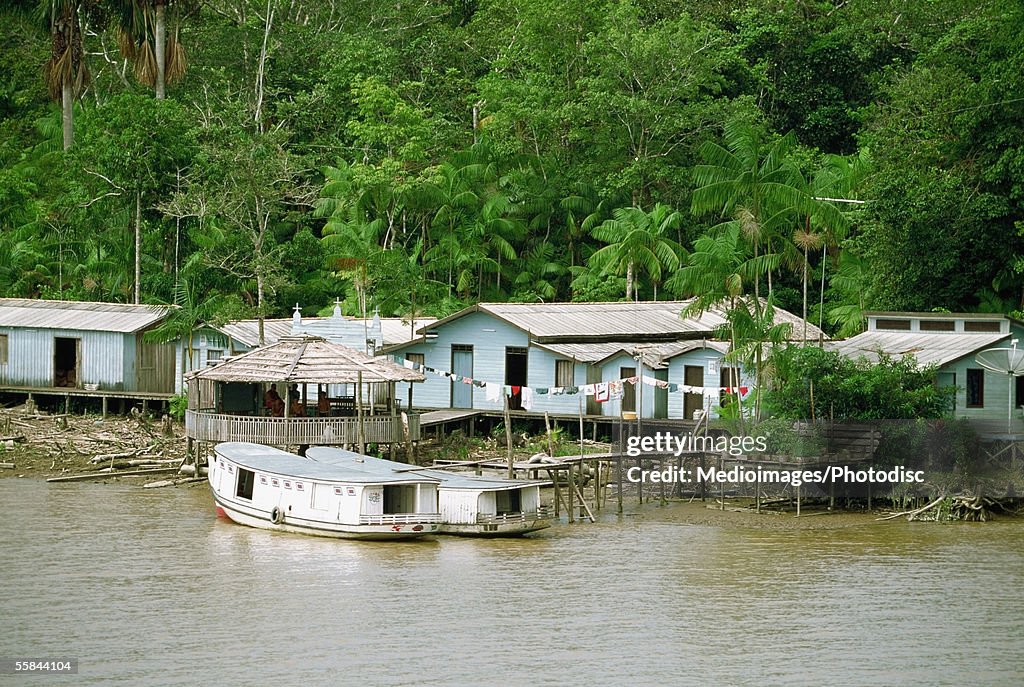 Boats and houses on Breves Narrows on the Amazon River, Brazil