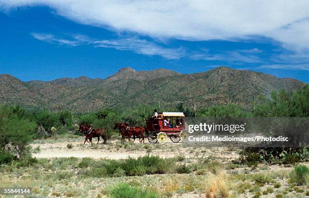 old-fashioned stagecoach pulled by horses, old tucson, arizona, usa - stage coach stock pictures, royalty-free photos & images