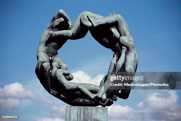 low angle view of the circle of life sculpture, gustav vigeland sculpture park, oslo, norway - oslo city life stock pictures, royalty-free photos & images