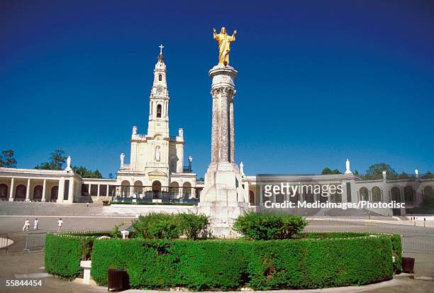 low angle view of the statue of jesus christ, lady of fatima chapel, fatima, portugal - fatima portugal stock-fotos und bilder