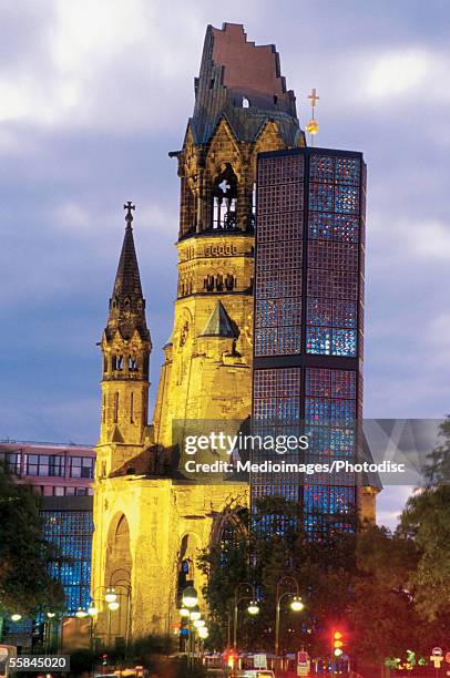 low angle view of the kaiser wilhelm memorial church, kurfurstendamm, berlin, germany - kurfürstendamm stock pictures, royalty-free photos & images