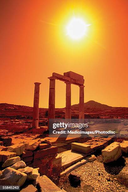 columns in the precinct of the priest of poseidon, delos, greece - delos stock-fotos und bilder