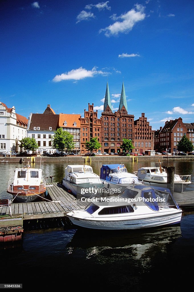 High angle view of boats docked at a river bank, Trave River, Lubeck, Germany