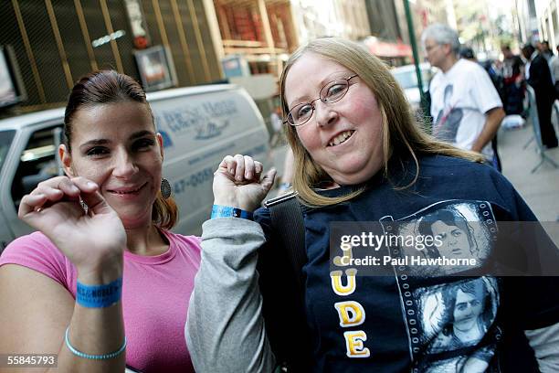 Elizabeth God and Jude Milne , of Staten Island, wait in line to see singer Paul McCartney make an appearance at Barnes & Noble Booksellers,...