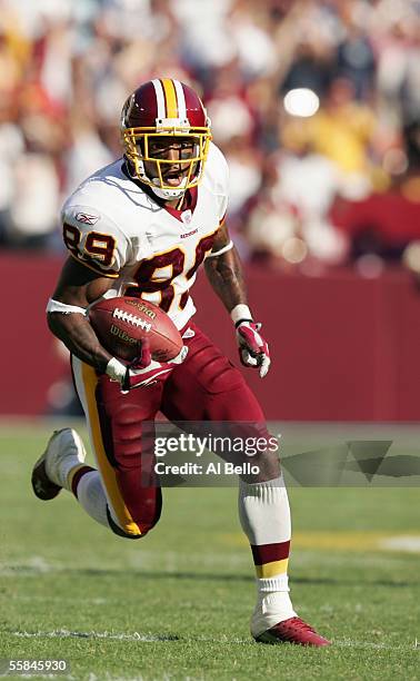 Santana Moss of the Washington Redskins carries the ball during the game with the Seattle Seahawks on October 2, 2005 at FedExField in Landover,...