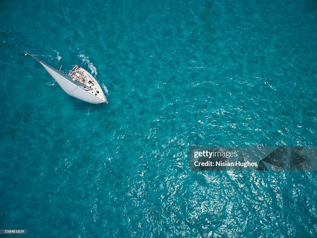 Aerial photo of sailboat sailing beautiful ocean