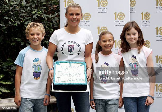 Wayne Rooney's girlfriend Coleen McLoughlin, whose little sister Rosie suffers from Rett Syndrome, poses in her jeans with 10-year-olds Luke Taylor,...