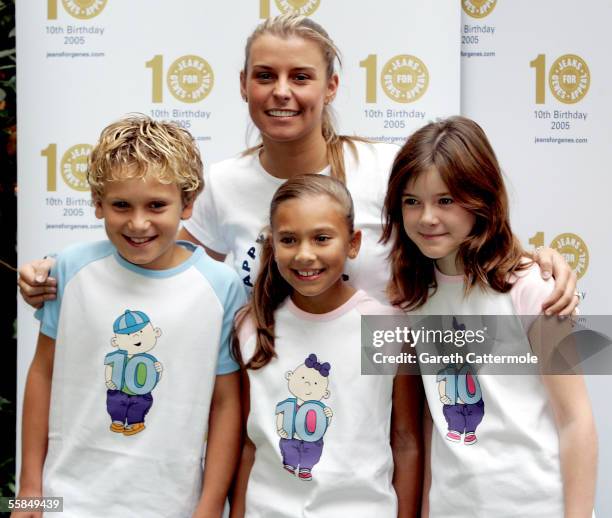 Wayne Rooney's girlfriend Coleen McLoughlin, whose little sister Rosie suffers from Rett Syndrome, poses in her jeans with 10-year-olds Luke Taylor,...