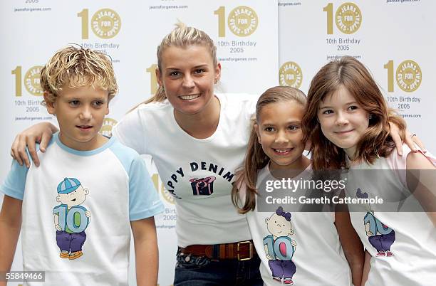 Wayne Rooney's girlfriend Coleen McLoughlin, whose little sister Rosie suffers from Rett Syndrome, poses in her jeans with 10-year-olds Luke Taylor,...