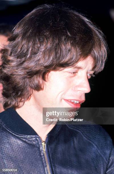 British rock and roll singer Mick Jagger of the group the Rolling Stones smiles a release party at the Trax nightclub for the band's 'Love You Live'...