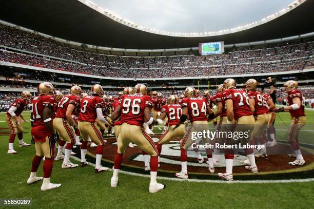 Players of the San Francisco 49ers cheer each other on before the start of the NFL game against the Arizona Cardinals at Estadio Azteca in Mexico...