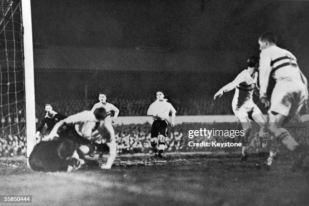 Farago, the Hungarian goalkeeper drops the ball by the post, taking a Wolverhampton Wanderers forward with him during a match at Molineux, 14th...