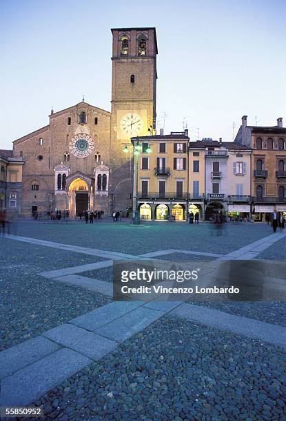 italy, lombardy, lodi, piazza della vittoria, duomo, dusk - lodi lombardy stock pictures, royalty-free photos & images