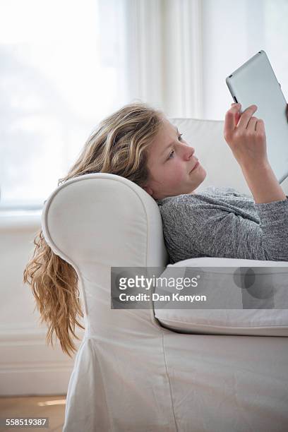 12 year old girl with tablet computer - 12 year old blonde girl stock-fotos und bilder