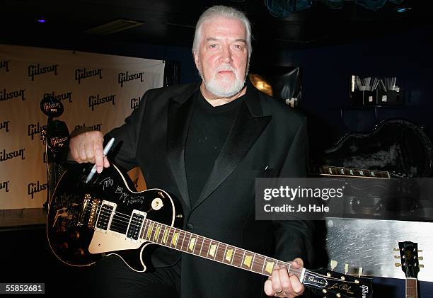 John Lord of Deep Purple poses with a guitar in the Awards Room at the Classic Rock Roll Of Honour, the music magazine's inaugural awards, at Cafe de...